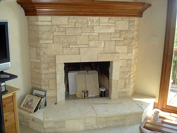 Hand-Cut Carmel Limestone Fireplace